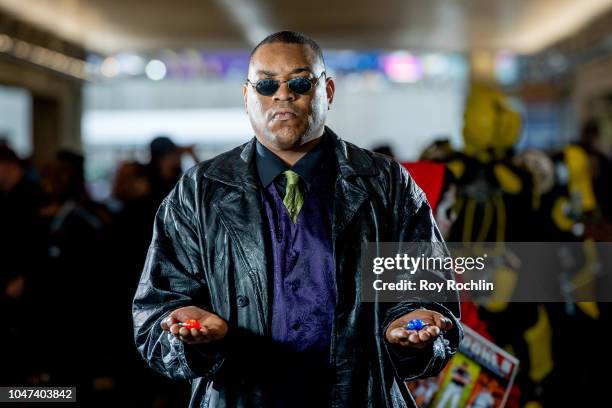 Fan cosplays as Morpheus from The Matrix during the 2018 New York Comic-Con at Javits Center on October 7, 2018 in New York City.