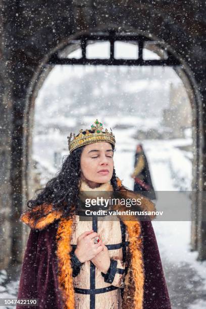 portrait of a queen in front of her castle - royal film stock pictures, royalty-free photos & images