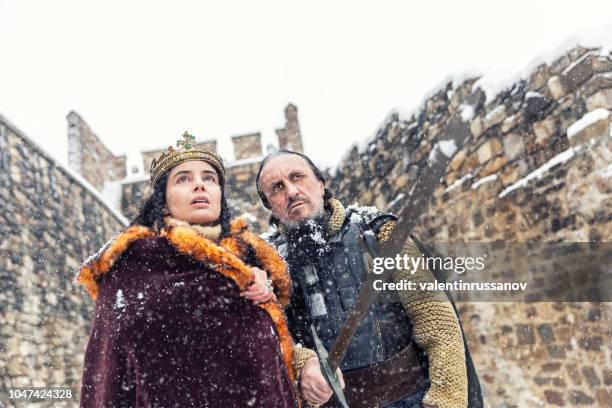 portrait of queen with his warrior in her castle - royal film stock pictures, royalty-free photos & images