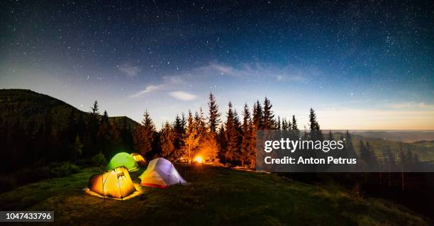 panorama of the camp at night under the starry sky - campfire background stock pictures, royalty-free photos & images