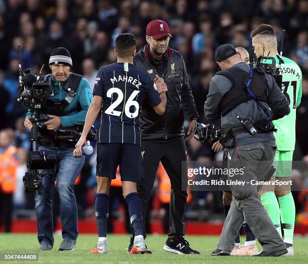 Liverpool manager Jurgen Klopp greets Manchester City's Riyad Mahrez at the final whistle during the Premier League match between Liverpool FC and...