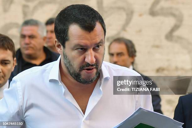 Italy's Interior Minister, Matteo Salvini arrives on October 8, 2018 to the headquarters of the Unione Generale del Lavoro trade union in Rome, to...