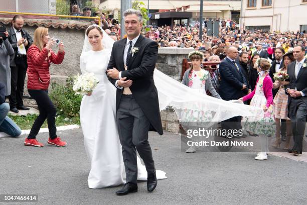 Princess Alina of Romania arrives with her godfather Liviu Popescu for her wedding ceremony at Sfantul IIie church on September 30, 2018 in Sinaia,...