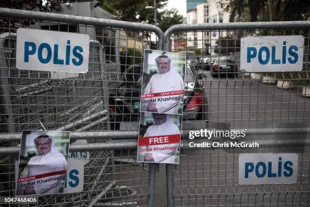 Posters of Saudi journalist Jamal Khashoggi are seen stuck to a police barricade in front of Saudi Arabia's consulate on October 8, 2018 in Istanbul,...