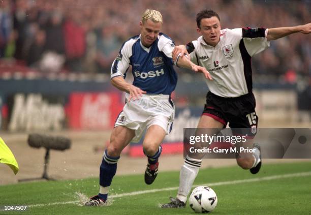 Paul Heckingbottom of Darlington holds off David Farrell of Peterborough during the Division 3 Play - Off Final at Wembley...