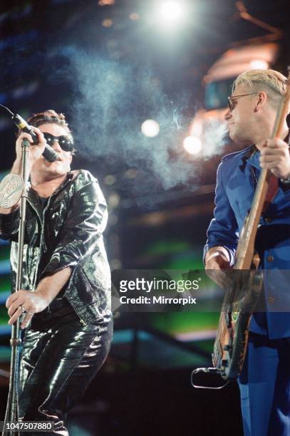 Concert, Zoo TV Tour, Cardiff Arms Park, Cardiff, Wales, Wednesday 18th August 1993, picture shows lead singer Bono and bass guitarist Adam Clayton...