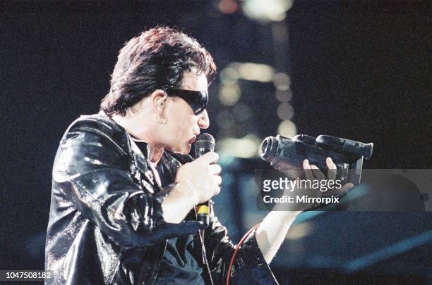 Concert, Zoo TV Tour, Cardiff Arms Park, Cardiff, Wales, Wednesday 18th August 1993, picture shows lead singer Bono on stage with camcorder.