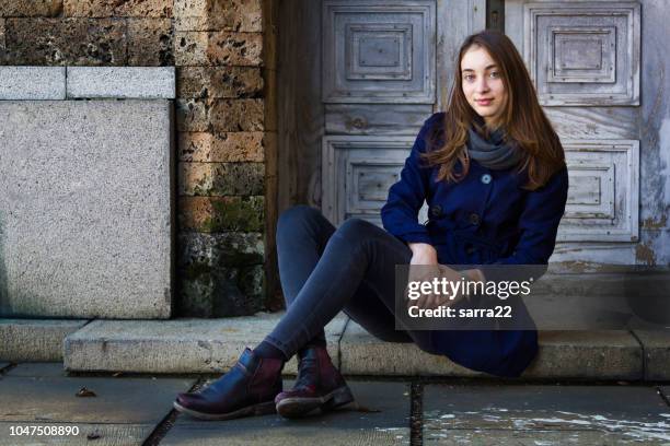 beautiful girl sitting - boots stock pictures, royalty-free photos & images