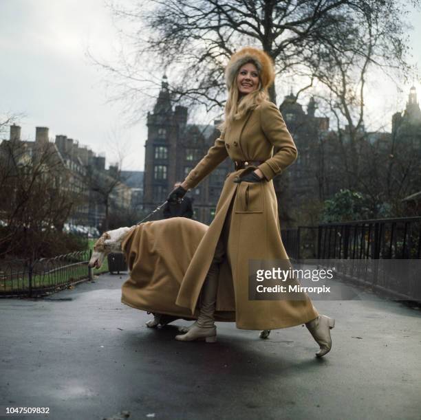 The first maxi coat for dogs gets its maiden outing in London with model Vicki Hodge and three-year-old Borzoi Sneshok Sokolova . Vicki's coat is by...