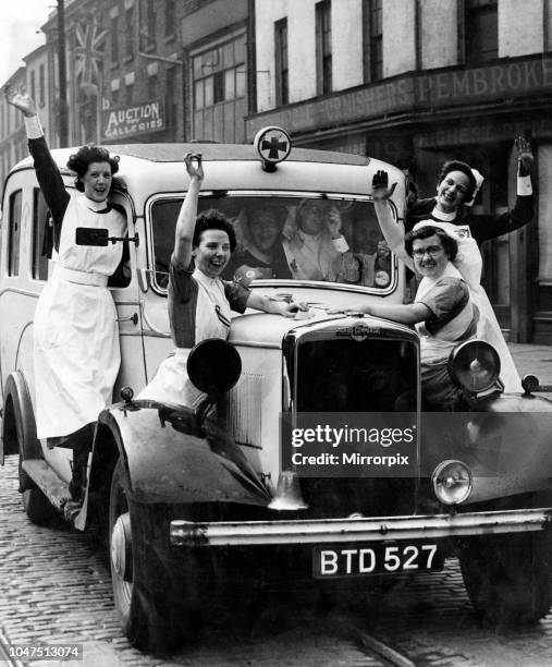 Jubilant nurses celebrate VE-Day in Liverpool. 8th May 1945.