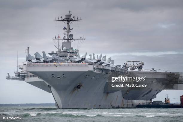 The US warship USS Harry S. Truman is pictured anchored in The Solent on October 8, 2018 near Portsmouth, England. The nuclear powered aircraft...