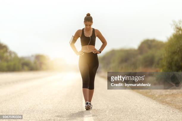 walking on road - runner resting stock pictures, royalty-free photos & images