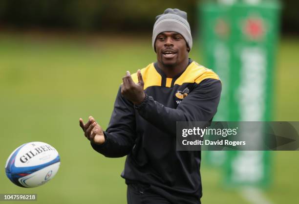 Christian Wade passes the ball during the Wasps training session held on October 8, 2018 in Coventry, England.