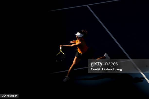 Xu Yifan of China hits a return with Gabriela Dabrowski of Canada against Andrea Sestini Hlavackova and Barbora Strycova of Czech Republic during...