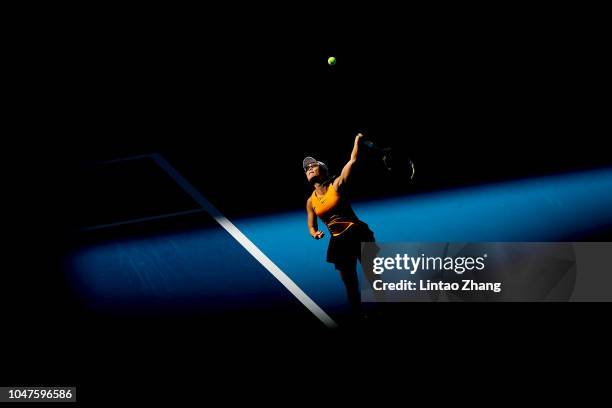 Xu Yifan of China hits a return with Gabriela Dabrowski of Canada against Andrea Sestini Hlavackova and Barbora Strycova of Czech Republic during...