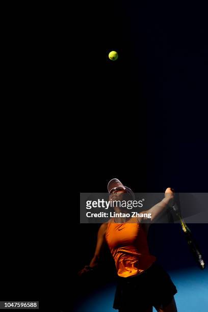 Xu Yifan of China hits a return with Gabriela Dabrowski of Canada against Andrea Sestini Hlavackova and Barbora Strycova of Czech Republic during...