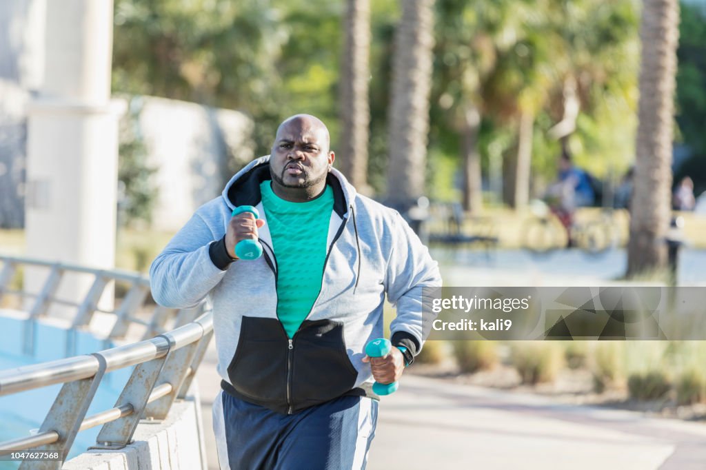 African-American man jogging or power walking