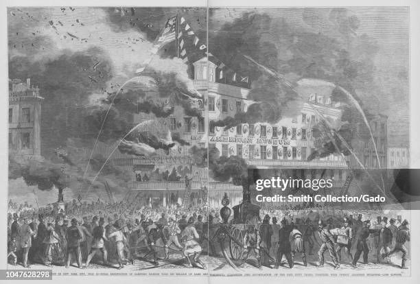 Engraving of the Barnum's American Museum in flames, firemen and local residents attempting to extinguish the fire, New York City, 1870. From the New...