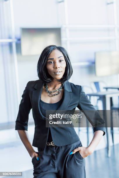 young african-american businesswoman in pant suit - black trouser suit stock pictures, royalty-free photos & images