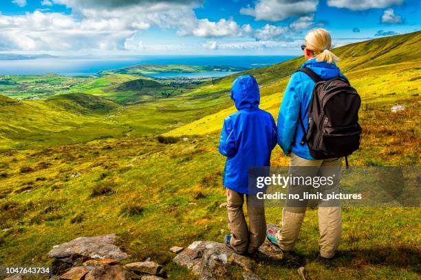 woman and boy hiking in ireland - ring of kerry ireland stock pictures, royalty-free photos & images