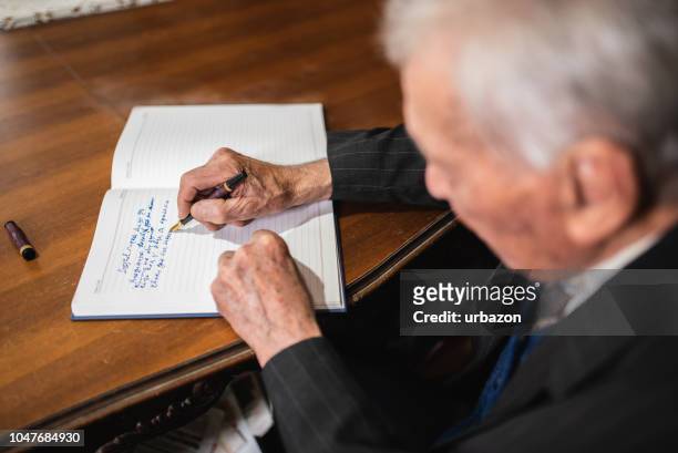 elderly man making retirement plan - answering stock pictures, royalty-free photos & images