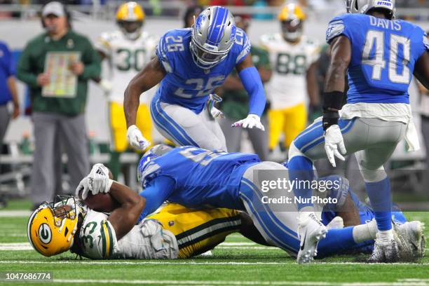 Green Bay Packers running back Aaron Jones is sacked by Detroit Lions linebacker Christian Jones , Detroit Lions defensive back DeShawn Shead ,...