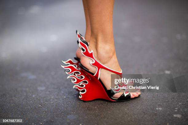 Alexandra Lapp wearing Cindy Blazer with graphic pattern by Airfield, a red leather pencil skirt by American Retro, red flame wedge sandal heels from...