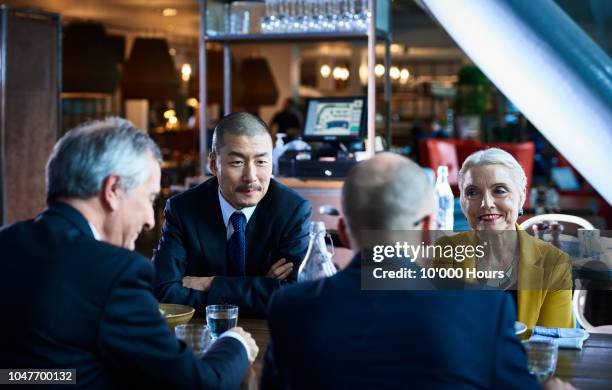 senior management team meeting over dinner - global leadership dinner stock pictures, royalty-free photos & images