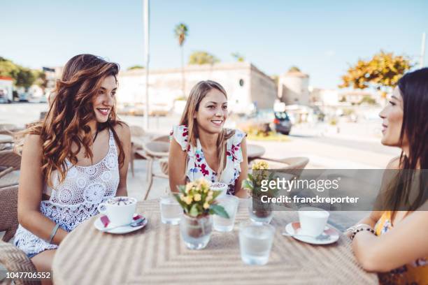 friends doing breakfast in italy at the cafe - alghero stock pictures, royalty-free photos & images
