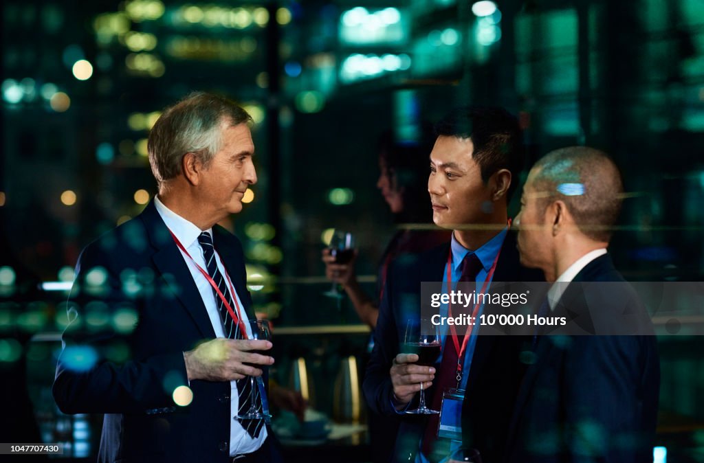 International businessmen at evening social event in the city