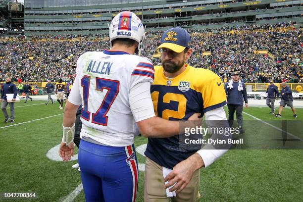 Josh Allen of the Buffalo Bills and Aaron Rodgers of the Green Bay Packers meet after the Green Bay Packers beat the Buffalo Bills 22-0 at Lambeau...
