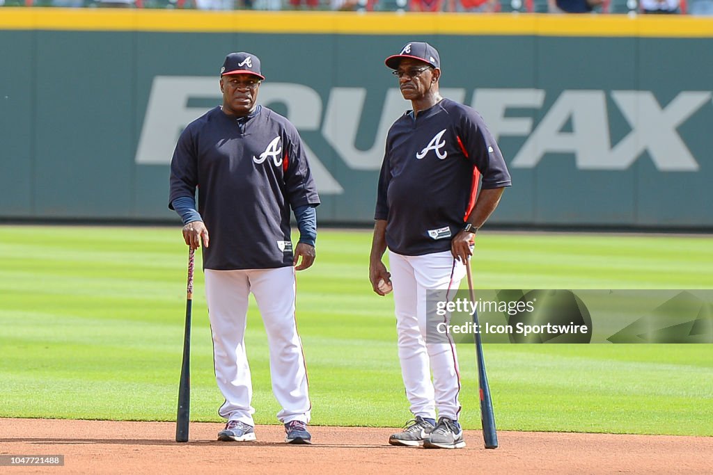 Atlanta Braves first base coach Eric Young, Sr. and third base coach ...