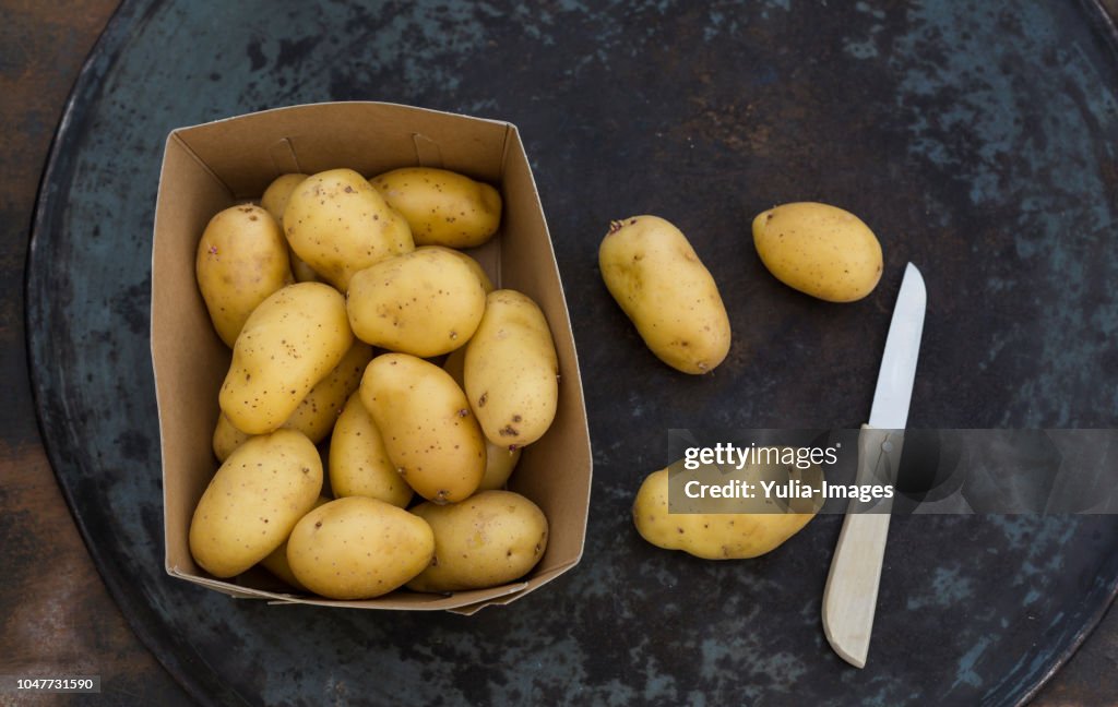 Fresh ripe potatoes on table