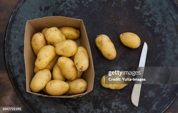 fresh ripe potatoes on table - potato sack stock pictures, royalty-free photos & images
