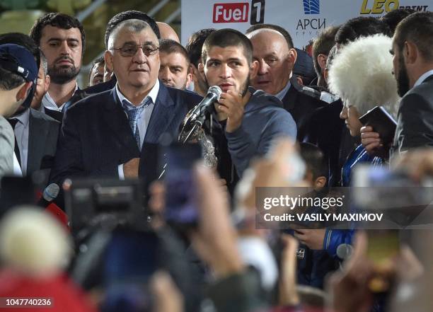 Lightweight champion Khabib Nurmagomedov of Russia speaks during his meeting with fans upon the arrival at the Anzhi-arena stadium in Makhachkala on...