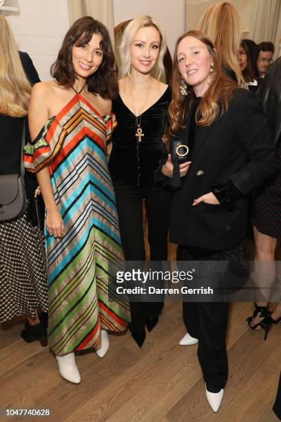 Jasmine Hemsley, Camilla al Fayed and Amy Powney toast goops's 10th anniversary at goop London pop-up on October 8, 2018 in London, England.