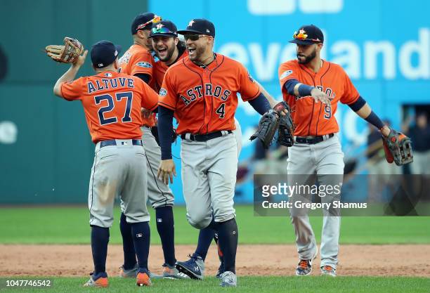 George Springer of the Houston Astros celebrates with teammates after defeating the Cleveland Indians 11-3 in Game Three of the American League...