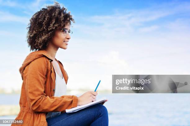 Writing Notebook Outside 5,358 Woman Writing In Notebook Outside Stock Photos, High-Res Pictures ...