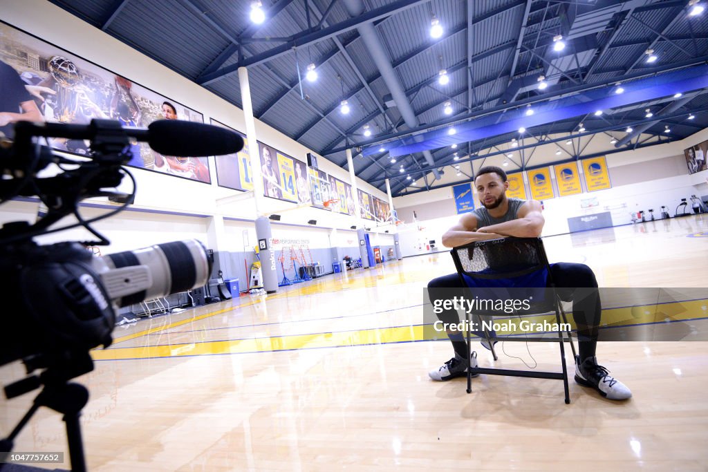 Stephen Curry of the Golden State Warriors talks with media during a