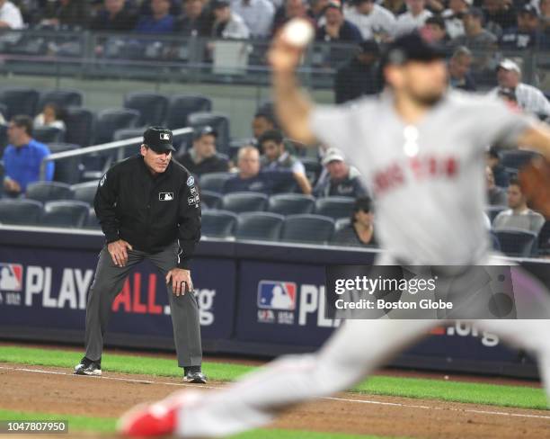 First base umpire Angel Hernandez in the fifth inning while Red Sox pitcher Nathan Eovaldi pitches. New York Yankees hosted the Boston Red Sox in...