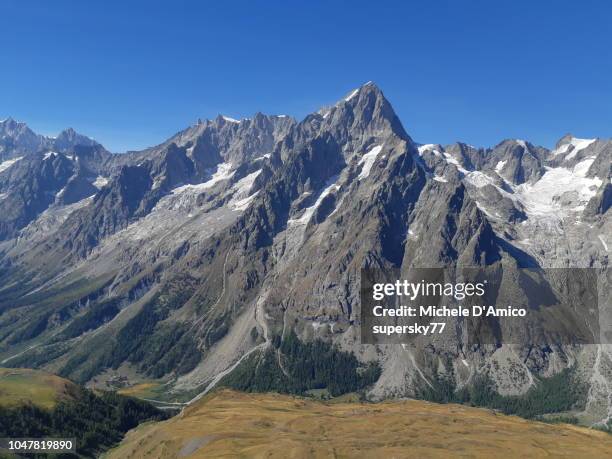 view on the mont blanc massif from a summit ridge in val ferret - crag stock-fotos und bilder