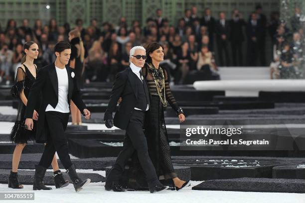 Model, Baptiste Giabiconi, Karl Lagerfeld and Ines de la Fressange walk the runway during the Chanel Ready to Wear Spring/Summer 2011 show during...