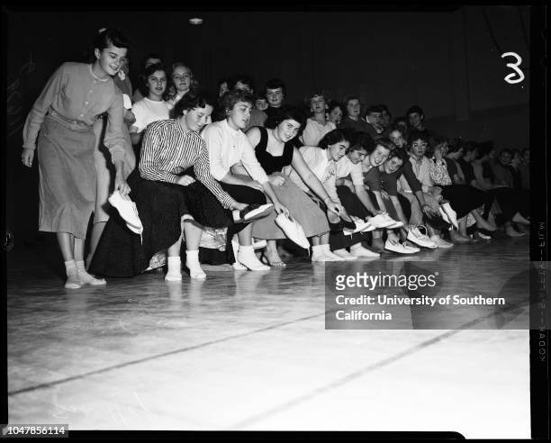 Dana Junior High School in San Pedro remove shoes to prevent damaging floor of new gym, 3 January 1956. Judy Mendenhall;Elaine Panousis;Joyce...