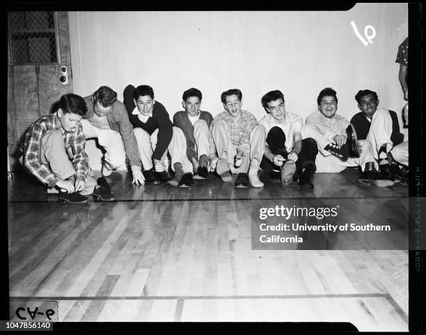 Dana Junior High School in San Pedro remove shoes to prevent damaging floor of new gym, 3 January 1956. Judy Mendenhall;Elaine Panousis;Joyce...