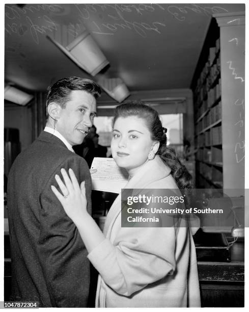 Anti-romance rule of law firm broken , 6 February 1957. Jay M Taylor -- 30 years attorney. Elaine Barbara Eagle -- 18 years. .;Caption slip reads:...