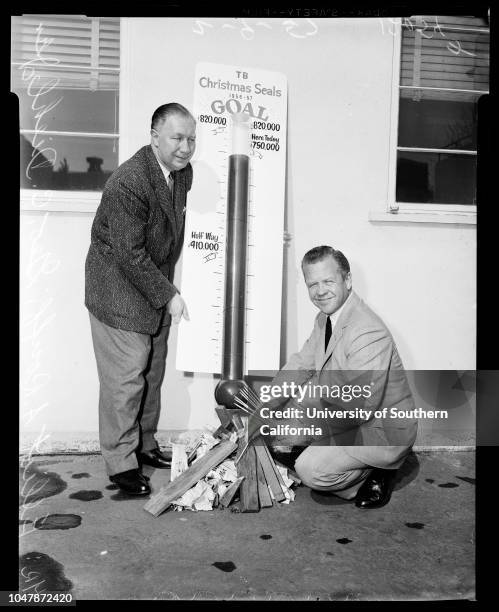 Xmas seal fund drive , 09 February 1957. Elliott A Rouff - Dr. M.D.;George C Diehl Jr.;Supplementary material reads: 'Builds fire under drive -...