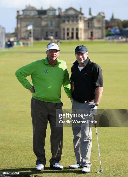 Former cricket stars Ian Botham of England and Steve Waugh of Australia pose for a picture on the first fairway during the second practice round of...