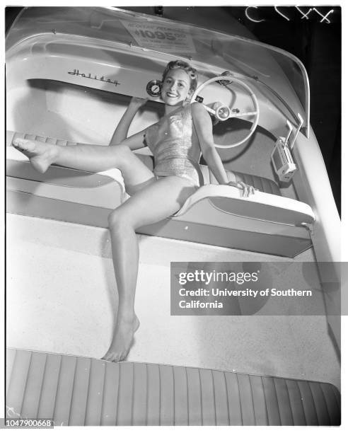 Boat show at Great Western Livestock Building, 13 February 1958. Juli Relding ;Derith Lindsay -- 17 years. Dorene Porter .;Caption slip reads:...