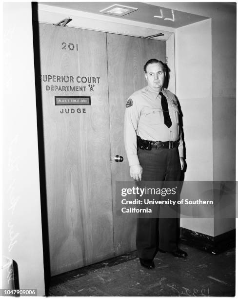 Cheryl Crane hearing, 23 April 1958. Judge Allen T Lynch;Court room doors;Deputy Sheriff Rex Kent.;Caption slip reads: 'Photographer: Gaze. Date: ....