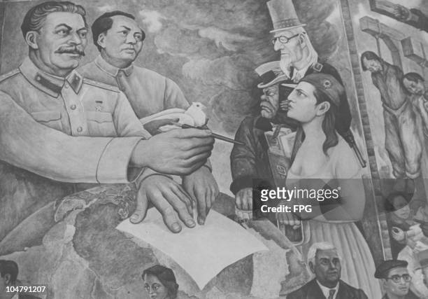 Detail from the mural 'Nightmare of War and Dream of Peace' by Diego Rivera, 31st March 1952. On the left, Joseph Stalin and Mao Tse-tung hold out...